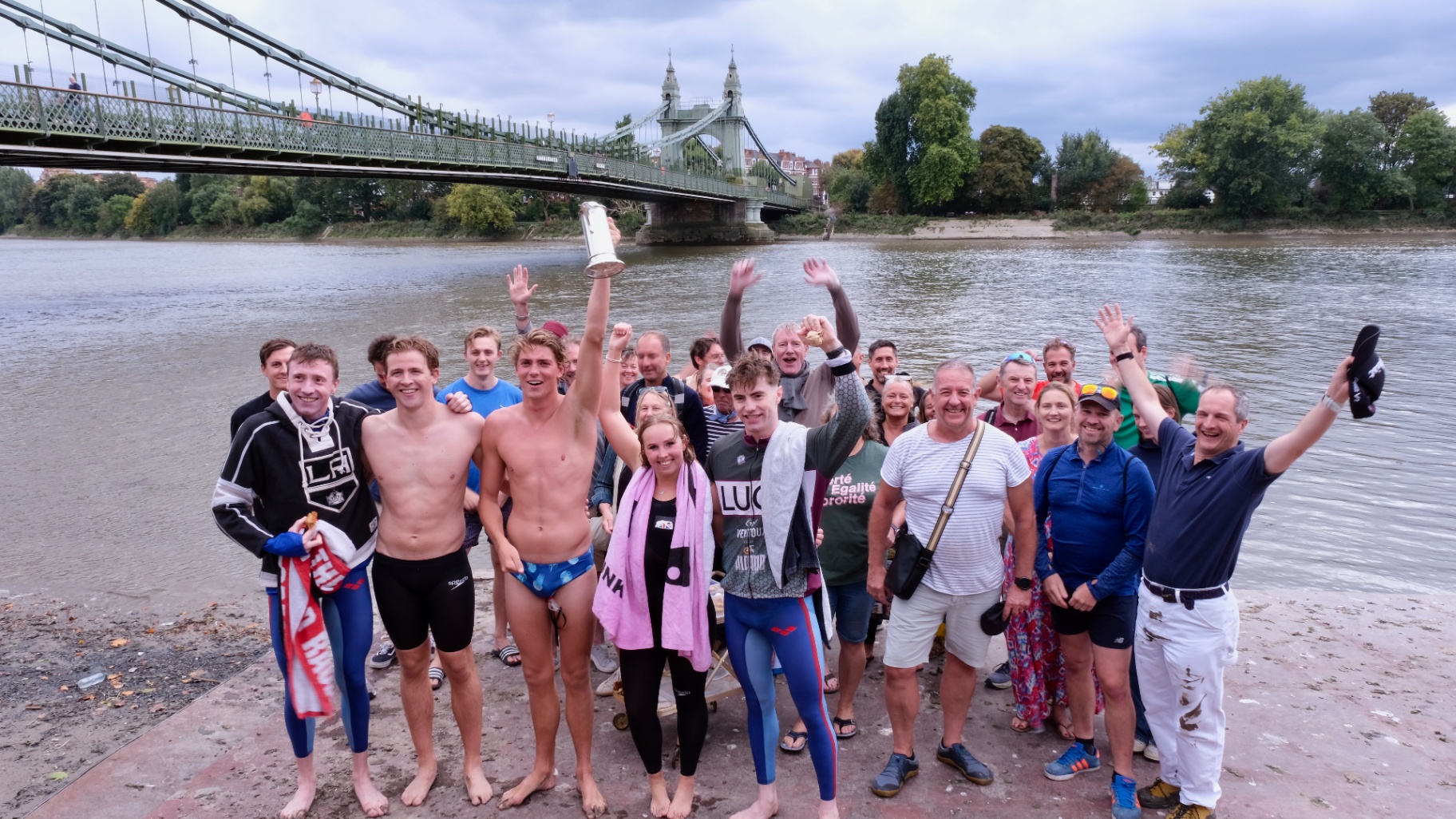 Swimmers celebrating together after finishing