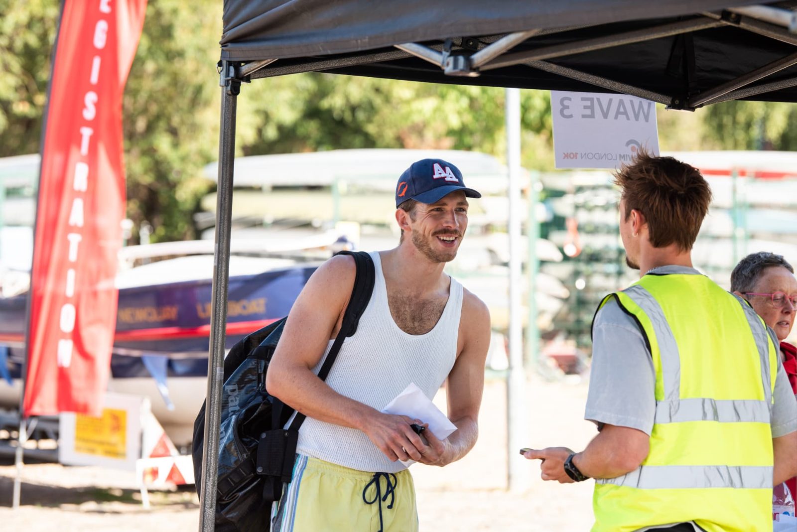A swimmer checking in at the Wave 3 registration tent before the start